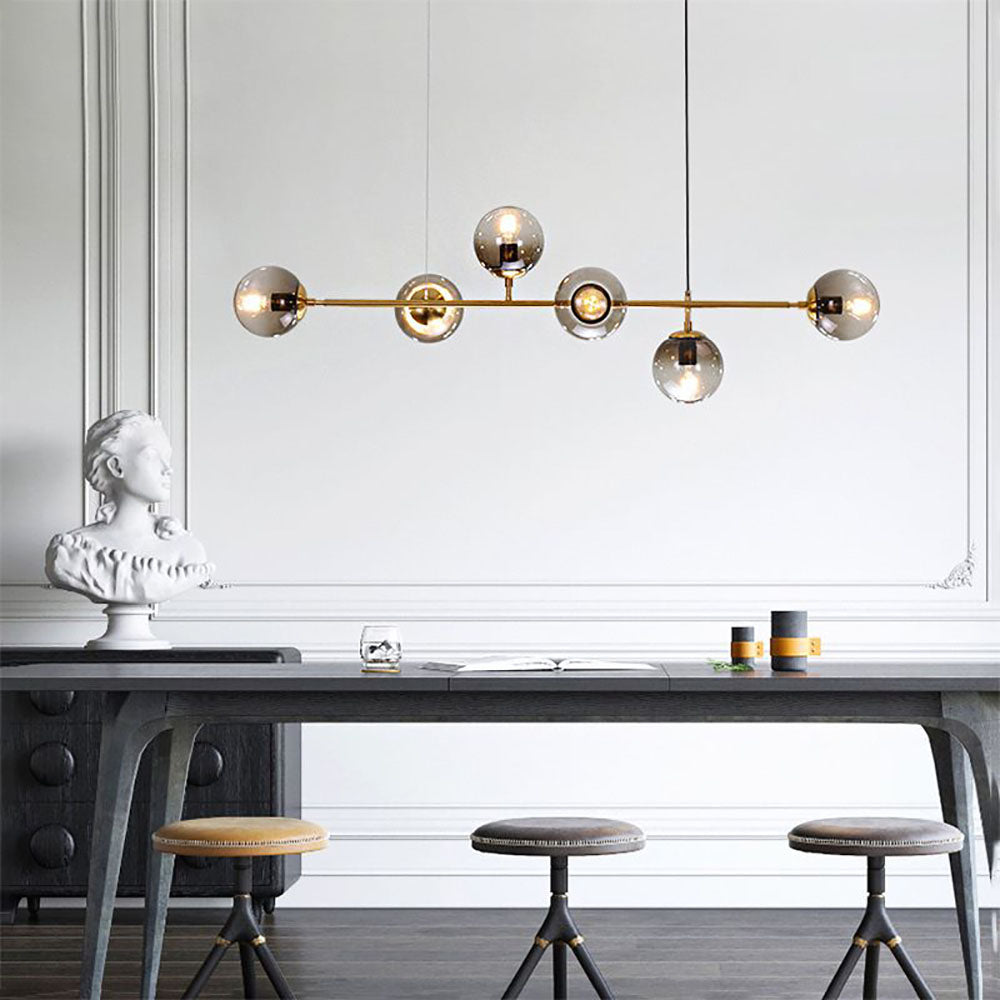 Suspension bulle en verre finition or pour espaces de vie d'ambiance