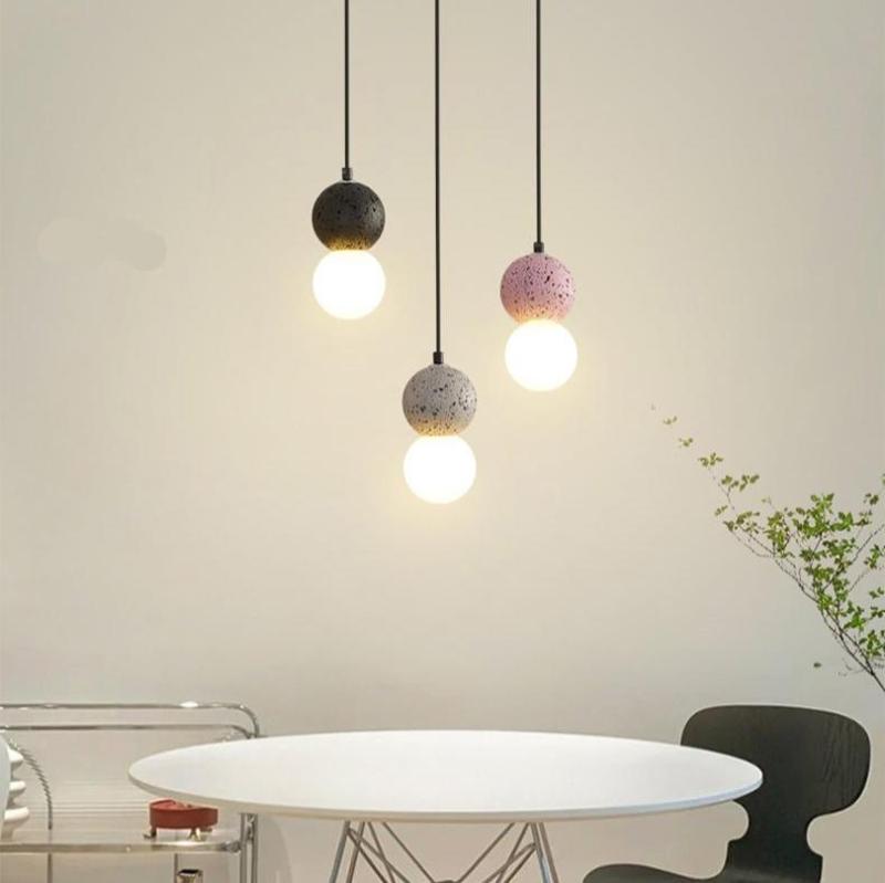 Suspension double orbe en travertin avec lumière chaude
